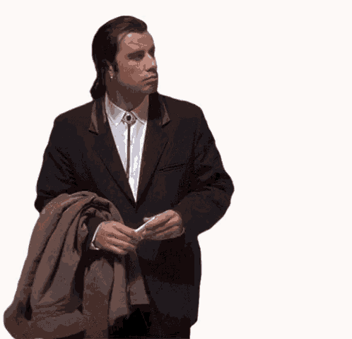 gif of John Travolta unable to find something